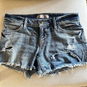 Guess cut off distressed Jean shorts with embroidery. Size 23